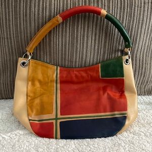 Beautiful leather bag by Astore. Tan with red gold green and blue patches